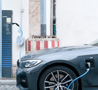 black car parked beside white building
